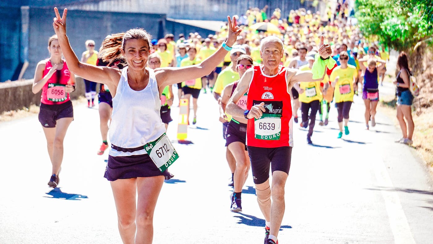 Runners racing with bib numbers